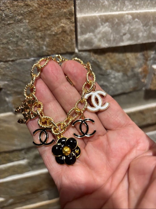 Jewelry - Gold Charm Bracelet with Black CC Flower and CC Logos